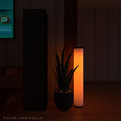 A tall, cylindrical Polar lamp emitting a warm orange light, positioned next to a potted snake plant and a dark speaker or column in a room.
